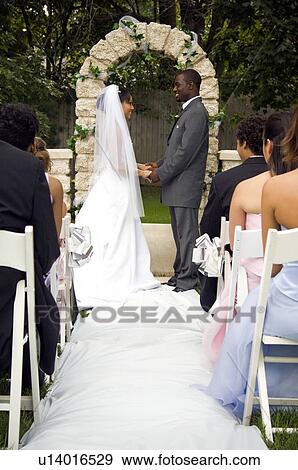 Bride and Groom at altar View Large Photo Image Stock Photo - Bride and Groom at altar. Fotosearch