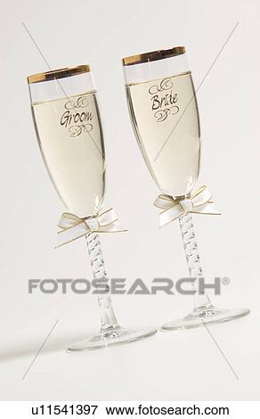 Bride and groom champagne glasses View Large Photo Image Stock Photo - Bride and groom champagne glasses. Fotosearch