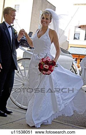 Bride and groom getting out of carriage View Large Photo Image Stock Image - Bride and groom getting out of carriage. Fotosearch