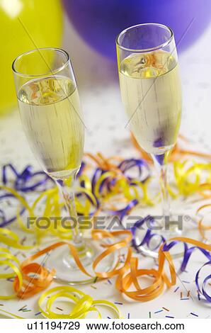 Champagne glasses with ribbons and balloons View Large Photo Image Stock Photo - Champagne glasses with ribbons and balloons. Fotosearch