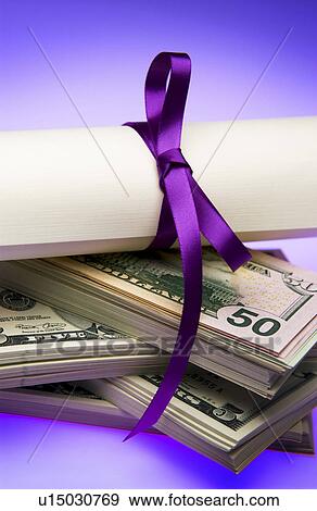 Diploma with money View Large Photo Image Stock Photo - Diploma with money. Fotosearch