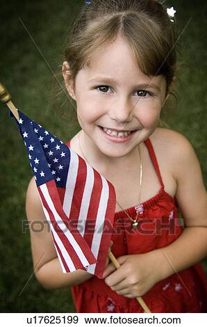 Stock Photo - Girl holding American Flag. Fotosearch