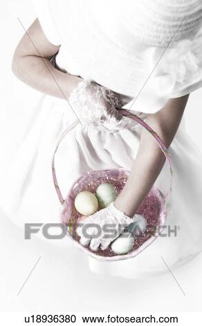 Girl holding Easter basket View Large Photo Image Stock Image - Girl holding Easter basket. Fotosearch