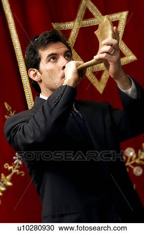 Man blowing shofar View Large Photo Image Stock Image - Man blowing shofar. Fotosearch