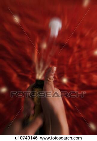 Stock Photograph - Opening champagne bottle. Fotosearch