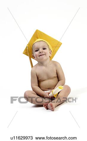 Stock Image - Toddler wearing mortarboard cap. Fotosearch