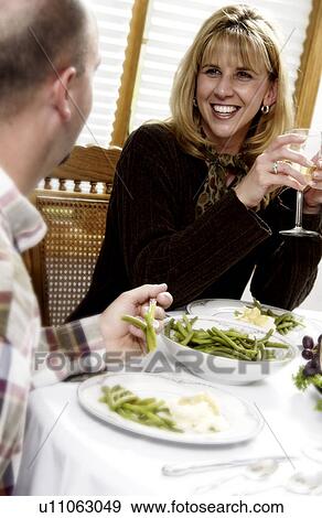 Stock Photo - Woman at holiday dinner. Fotosearch