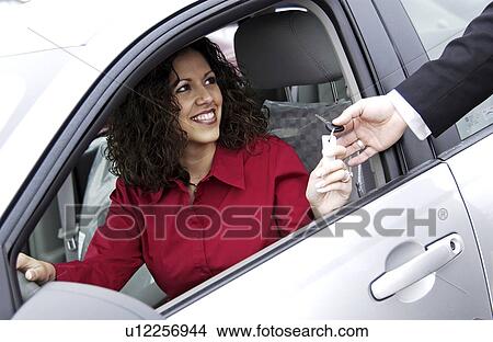 Woman purchasing a new car View Large Photo Image Picture - Woman purchasing a new car. Fotosearch