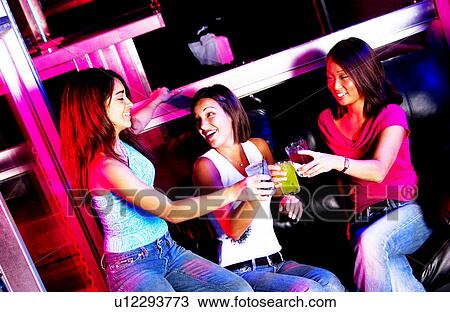 Young adults at a nightclub View Large Photo Image Stock Image - Young adults at a nightclub. Fotosearch