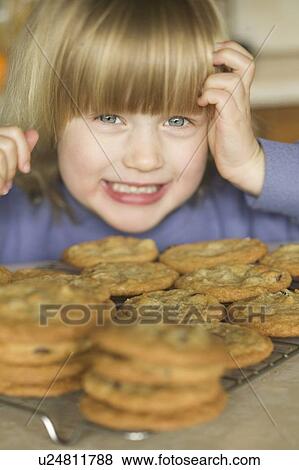 4 Year Old Girl Making Chocolate Chip Cookies, West Vancouver, B. C. View Large Photo Image Stock Photo - 4 Year Old Girl Making Chocolate Chip Cookies, West Vancouver, B. C.. Fotosearch
