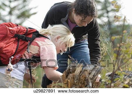 A woman and a young girl explore nature. River Trail, Williams Lake, BC. View Large Photo Image Stock Image - A woman and a young girl explore nature. River Trail, Williams Lake, BC.. Fotosearch