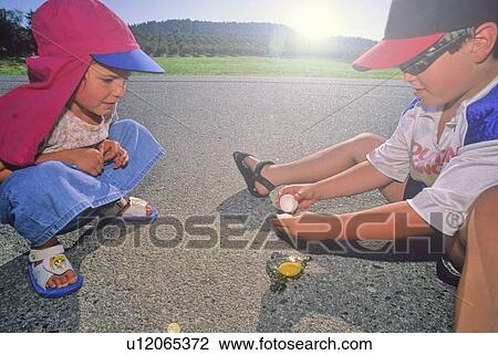 Boy, 6, and girl, 3, try to fry and egg on the sidewalk in hot summer weather, Kelowna, BC Canada View Large Photo Image Stock Image - Boy, 6, and girl, 3, try to fry and egg on the sidewalk in hot summer weather, Kelowna, BC Canada. Fotosearch