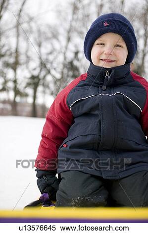 Child on snow slider, Regina, Saskatchewan, Canada View Large Photo Image Stock Photography - Child on snow slider, Regina, Saskatchewan, Canada. Fotosearch