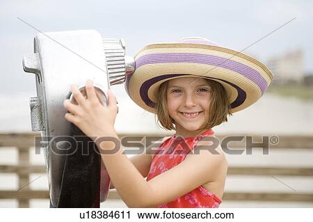 Stock Image - Girl - (5) with beach hat, Jacksonville, Florida. Fotosearch