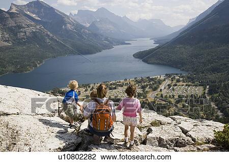 Stock Image - Mother and children enjoy view at Waterton Lakes National Park, Alberta Canada. Fotosearch