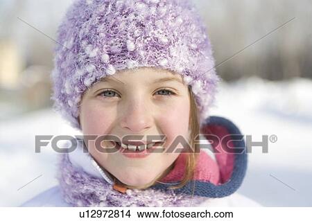 Picture - Portrait of 9 year-old girl outdoor in winter, Winnipeg, Canada. Fotosearch