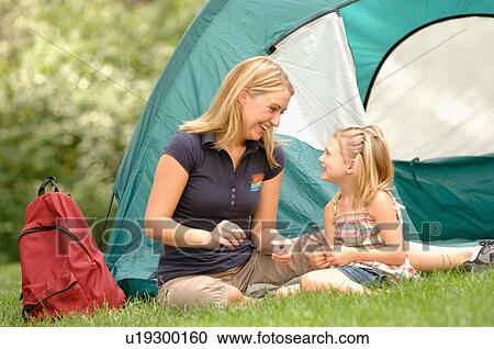 Stock Image - Young woman & child in front of tent, Regina, Saskatchewan. Fotosearch