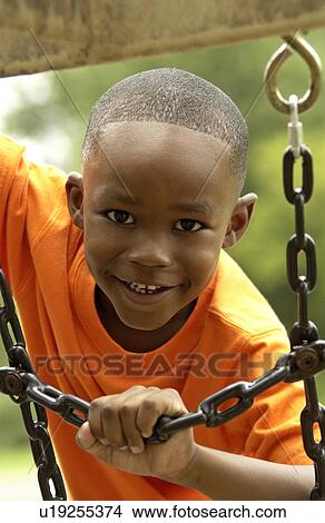 African American boy on playground View Large Photo Image Picture - African American boy on playground. Fotosearch