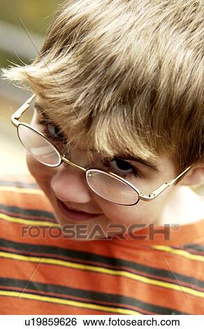 Boy with eyeglasses View Large Photo Image Stock Photograph - Boy with eyeglasses. Fotosearch