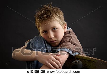 Stock Photography - Boy with skateboard. Fotosearch