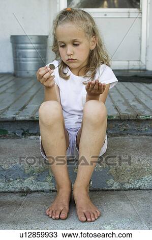 Stock Image - Girl counting money. Fotosearch