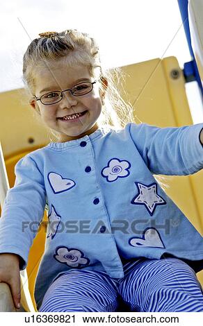 Girl going down slide View Large Photo Image Stock Image - Girl going down slide. Fotosearch