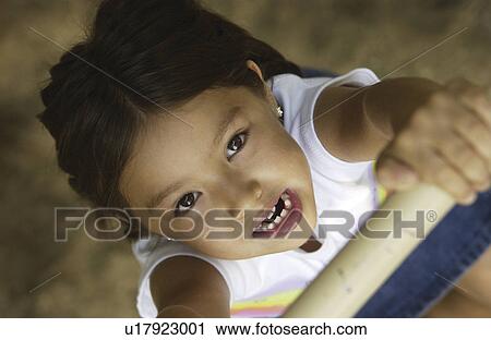 Stock Image - Girl on playground. Fotosearch