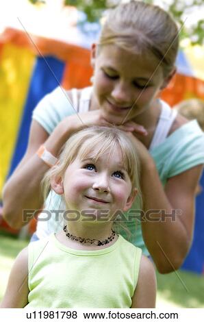 Stock Photo - Girls at carnival. Fotosearch