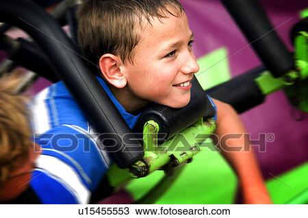 Kid on a carnival ride View Large Photo Image Stock Image - Kid on a carnival ride. Fotosearch