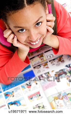 African American girl reading newspaper View Large Photo Image Stock Image - African American girl reading newspaper. Fotosearch