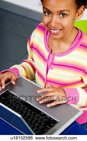 African American girl working on laptop View Large Photo Image Stock Photograph - African American girl working on laptop. Fotosearch