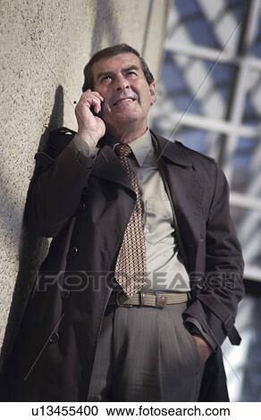 Stock Image - Businessman on cell phone. Fotosearch