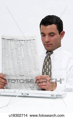 Picture - Businessman reading newspaper. Fotosearch
