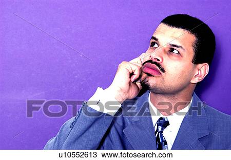 Businessman talking on cell phone View Large Photo Image Stock Image - Businessman talking on cell phone. Fotosearch