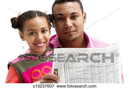 Father and daughter reading newspaper View Large Photo Image Stock Photo - Father and daughter reading newspaper. Fotosearch