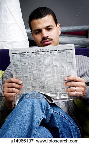 Stock Photo - Man reading newspaper. Fotosearch