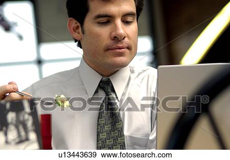 Man working on laptop View Large Photo Image Stock Photo - Man working on laptop. Fotosearch