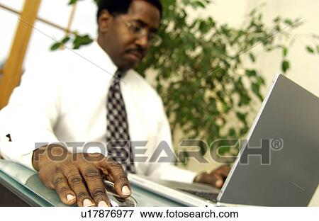 Man working on laptop View Large Photo Image Stock Photo - Man working on laptop. Fotosearch