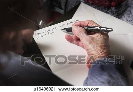 Stock Image - Senior woman writing a letter. Fotosearch