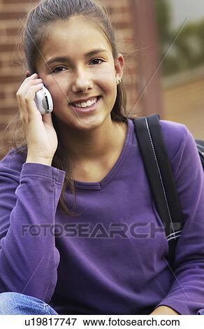 Teen girl on cell phone View Large Photo Image Stock Photo - Teen girl on cell phone. Fotosearch