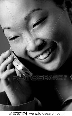 Picture - Woman on cell phone. Fotosearch