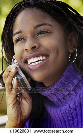 Stock Image - Woman on cell phone. Fotosearch
