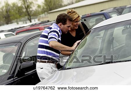 Couple car shopping View Large Photo Image Stock Image - Couple car shopping. Fotosearch