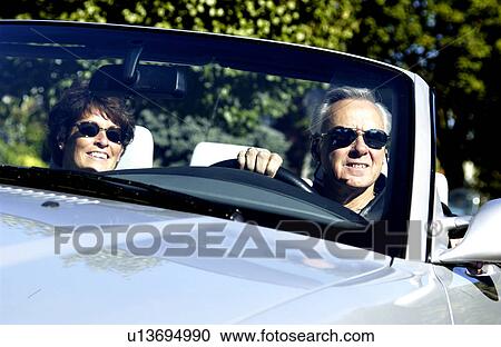 Couple in convertible View Large Photo Image Stock Image - Couple in convertible. Fotosearch