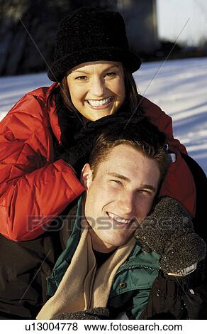 Couple in the snow View Large Photo Image Stock Photo - Couple in the snow. Fotosearch