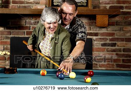 Couple playing pool View Large Photo Image Stock Photo - Couple playing pool. Fotosearch