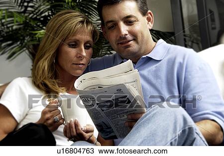 Couple reading the newspaper View Large Photo Image Stock Image - Couple reading the newspaper. Fotosearch