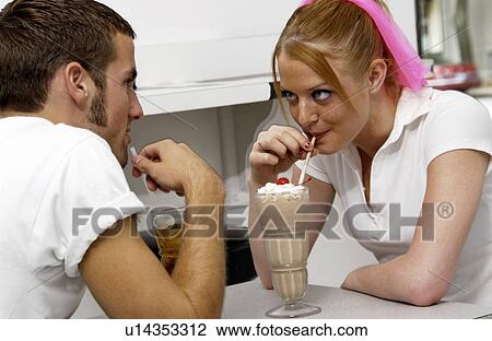 Couple sharing sodas View Large Photo Image Stock Image - Couple sharing sodas. Fotosearch