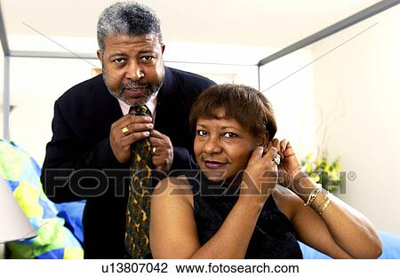 Senior couple getting ready for a night out View Large Photo Image Stock Image - Senior couple getting ready for a night out. Fotosearch