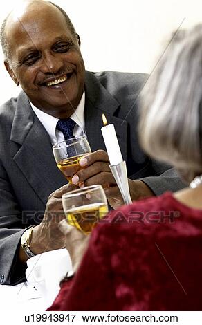 Stock Photo - Senior couple having a romantic meal. Fotosearch